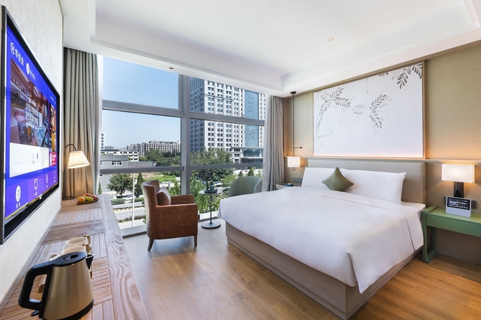 Imagen de la habitación del Hotel Manxin Beijing Bei Qi Jia Wen Du Shui Cheng. Foto 8