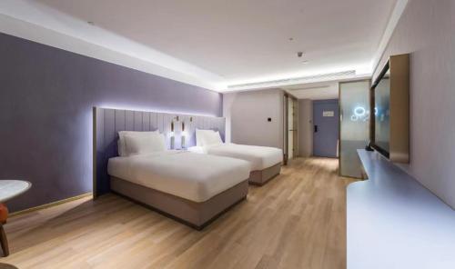 Imagen de la habitación del Hotel Manxin Guangzhou Baiyun Airport Branch. Foto 15