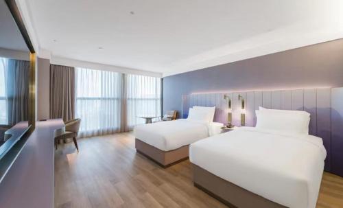 Imagen de la habitación del Hotel Manxin Guangzhou Baiyun Airport Branch. Foto 16