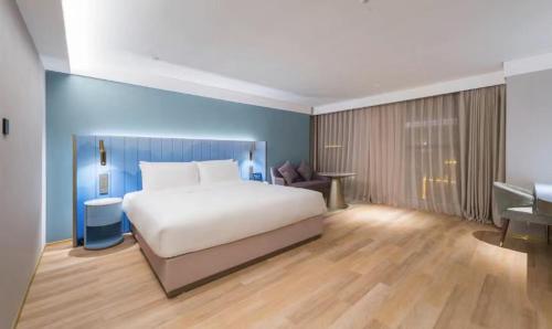 Imagen de la habitación del Hotel Manxin Guangzhou Baiyun Airport Branch. Foto 17