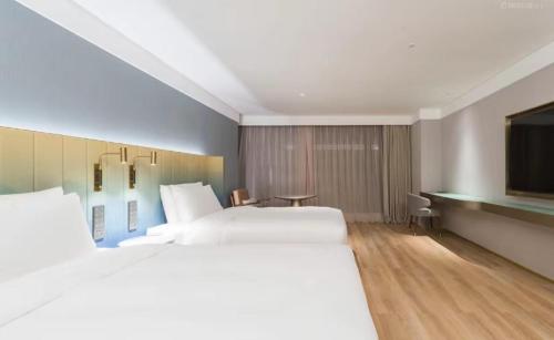 Imagen de la habitación del Hotel Manxin Guangzhou Baiyun Airport Branch. Foto 18