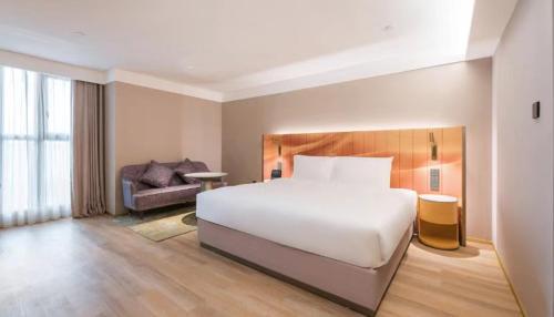 Imagen de la habitación del Hotel Manxin Guangzhou Baiyun Airport Branch. Foto 19