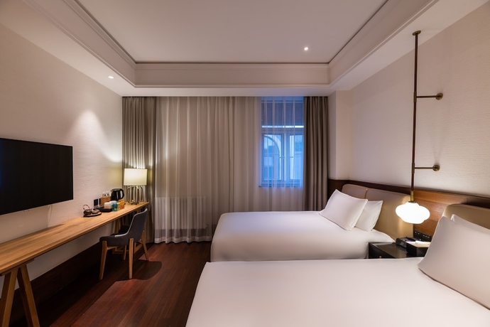 Imagen de la habitación del Hotel Manxin Qianmen Courtyard. Foto 11