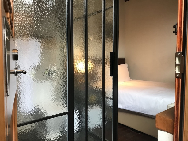 Imagen de la habitación del Hotel Manxin Qianmen Courtyard. Foto 15