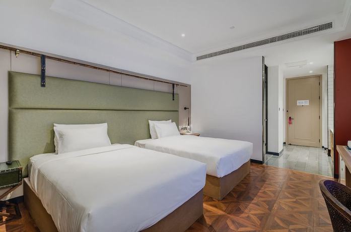 Imagen de la habitación del Hotel Manxin Qingdao Zhanqiao. Foto 4