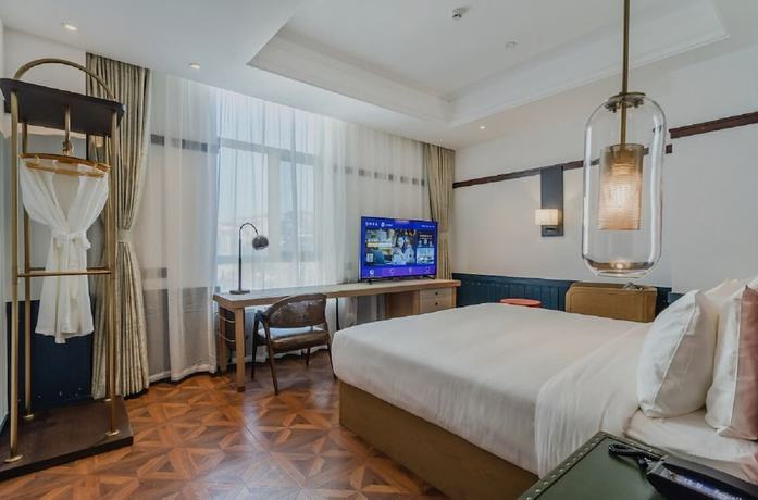 Imagen de la habitación del Hotel Manxin Qingdao Zhanqiao. Foto 8