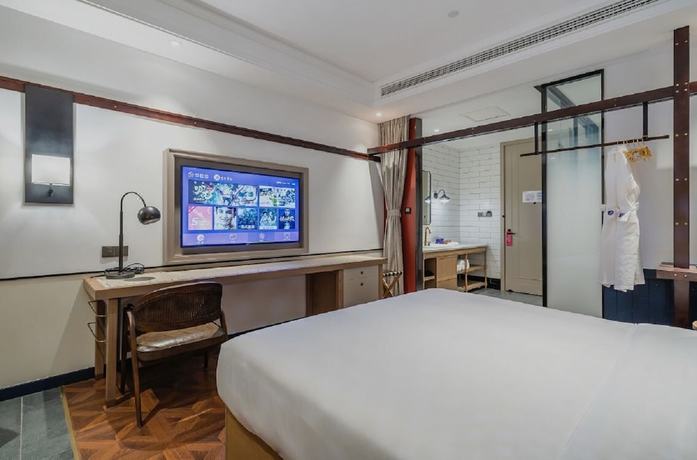Imagen de la habitación del Hotel Manxin Qingdao Zhanqiao. Foto 10
