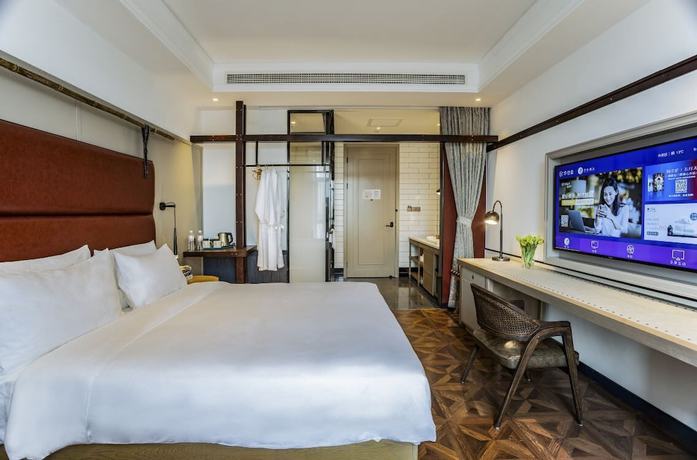 Imagen de la habitación del Hotel Manxin Qingdao Zhanqiao. Foto 12