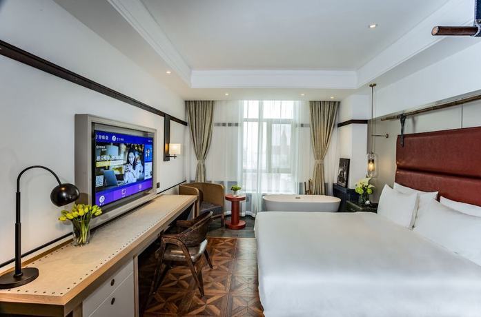 Imagen de la habitación del Hotel Manxin Qingdao Zhanqiao. Foto 14