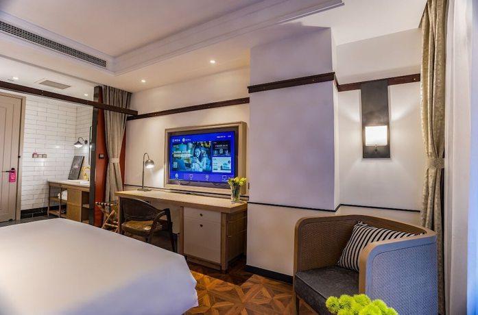 Imagen de la habitación del Hotel Manxin Qingdao Zhanqiao. Foto 15