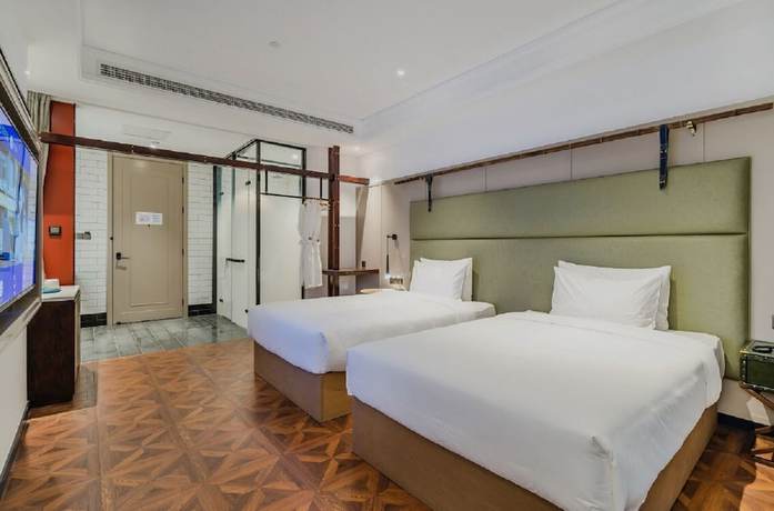 Imagen de la habitación del Hotel Manxin Qingdao Zhanqiao. Foto 16