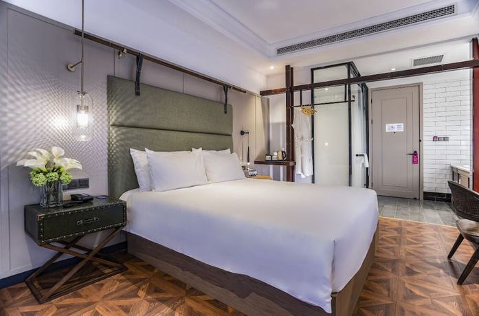 Imagen de la habitación del Hotel Manxin Qingdao Zhanqiao. Foto 18