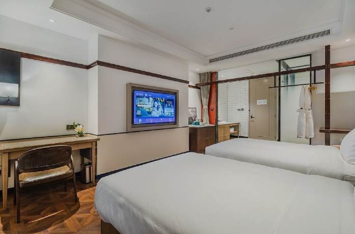 Imagen de la habitación del Hotel Manxin Qingdao Zhanqiao. Foto 19