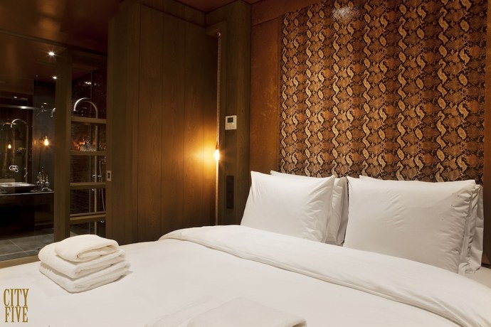 Imagen de la habitación del Hotel Manzo's Suites. Foto 9