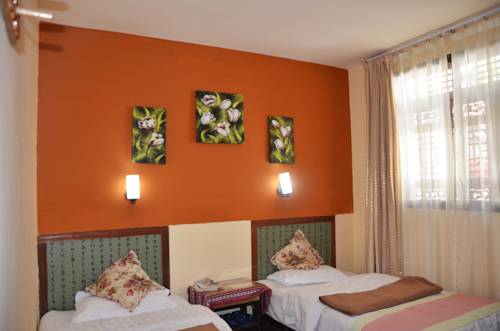Imagen de la habitación del Hotel Maple Leaf Inn, Lijiang. Foto 5