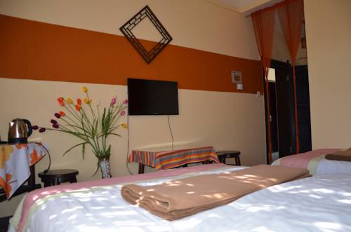 Imagen de la habitación del Hotel Maple Leaf Inn, Lijiang. Foto 7