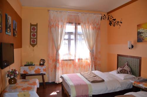 Imagen de la habitación del Hotel Maple Leaf Inn, Lijiang. Foto 8