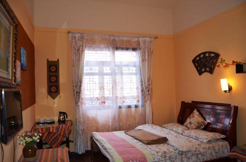 Imagen de la habitación del Hotel Maple Leaf Inn, Lijiang. Foto 9