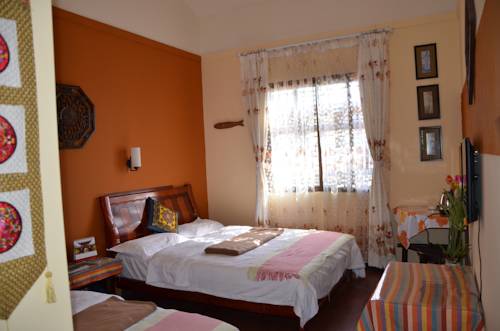Imagen de la habitación del Hotel Maple Leaf Inn, Lijiang. Foto 11