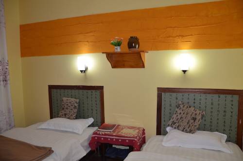 Imagen de la habitación del Hotel Maple Leaf Inn, Lijiang. Foto 13