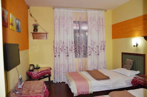Imagen de la habitación del Hotel Maple Leaf Inn, Lijiang. Foto 14