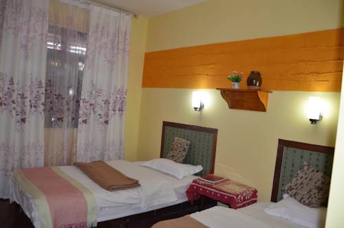 Imagen de la habitación del Hotel Maple Leaf Inn, Lijiang. Foto 16