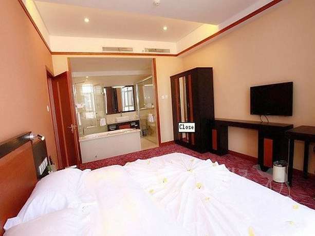 Imagen de la habitación del Hotel Maple Palace Hotel - Kunming. Foto 7