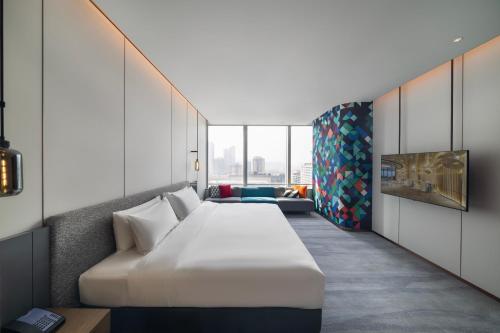 Imagen de la habitación del Hotel Maqo Changsha. Foto 16