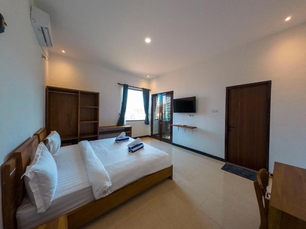 Imagen de la habitación del Hotel Mar Bella Beachfront. Foto 8