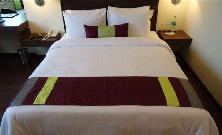 Imagen de la habitación del Hotel Marasa Sarovar Portico Rajkot. Foto 7