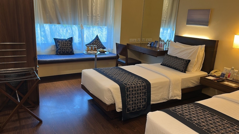 Imagen de la habitación del Hotel Marasa Sarovar Portico Rajkot. Foto 9
