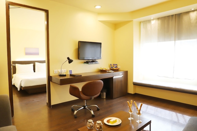 Imagen de la habitación del Hotel Marasa Sarovar Portico Rajkot. Foto 11