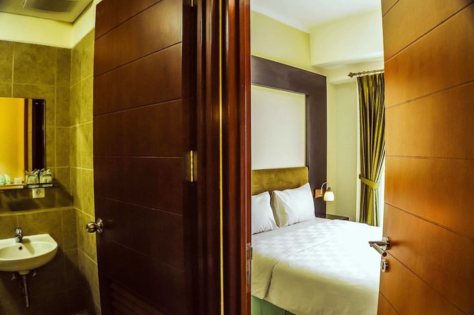 Imagen de la habitación del Hotel Marbella Suites Bandung. Foto 13