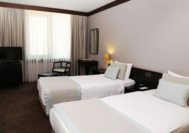 Imagen de la habitación del Hotel Marble. Foto 14