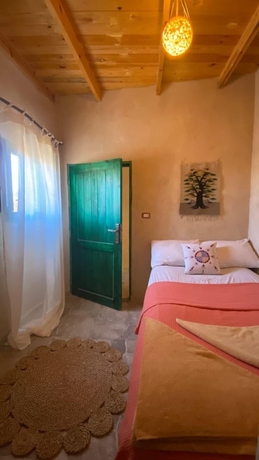 Imagen de la habitación del Hotel Marcelia Eco-Village Front Lake View. Foto 7