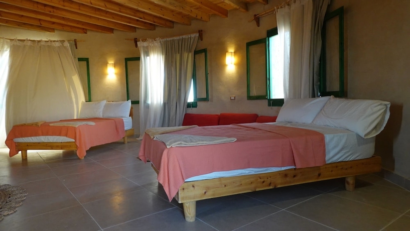 Imagen de la habitación del Hotel Marcelia Eco-Village Front Lake View. Foto 9