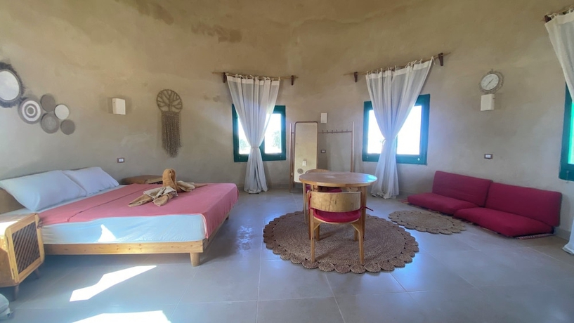 Imagen de la habitación del Hotel Marcelia Eco-Village Front Lake View. Foto 13