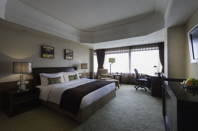 Imagen de la habitación del Hotel Marco Polo Parkside Beijing. Foto 10
