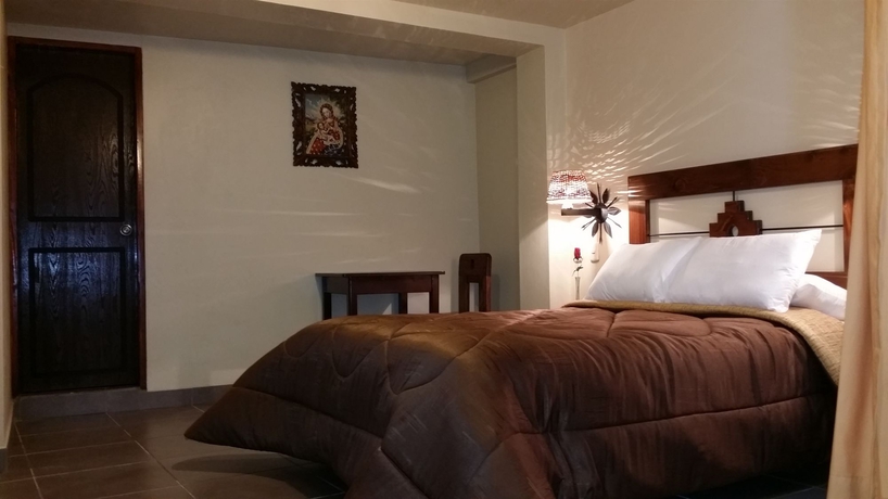 Imagen de la habitación del Hotel Marco Wasi. Foto 15