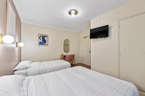Imagen de la habitación del Hotel Margot, Gare du Nord. Foto 19