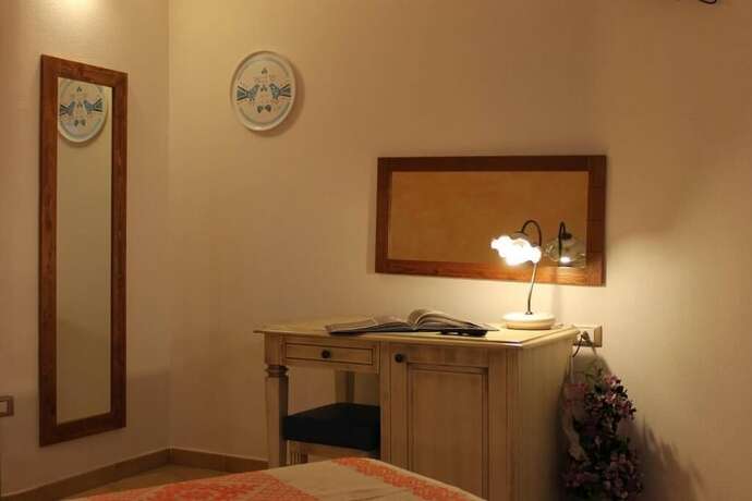 Imagen de la habitación del Hotel Maria Caderina Green Village. Foto 11