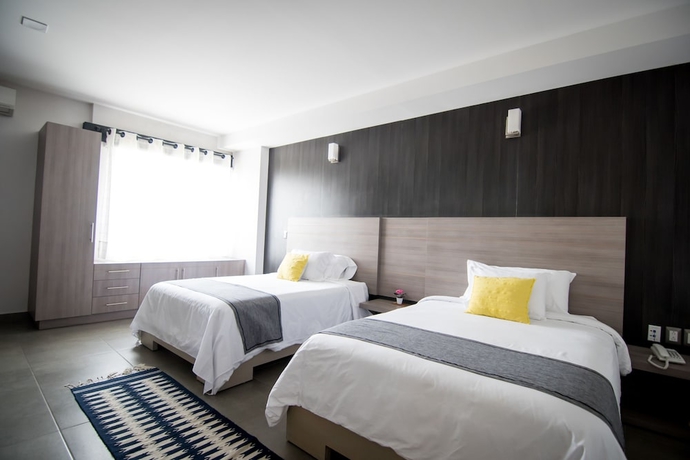 Imagen de la habitación del Hotel Maria Ines Suite. Foto 3