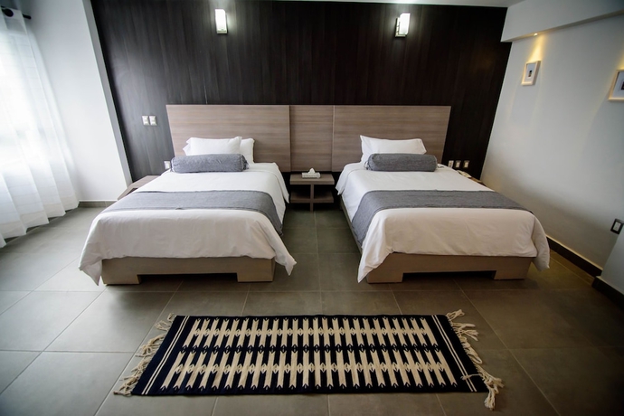 Imagen de la habitación del Hotel Maria Ines Suite. Foto 9