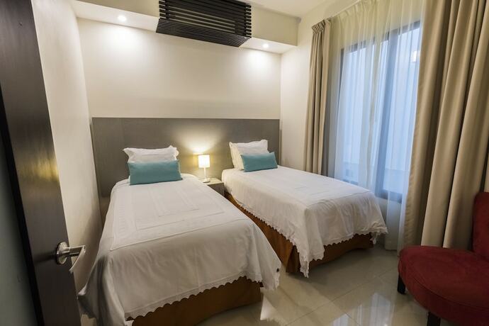 Imagen de la habitación del Hotel Marialicia Suites. Foto 14