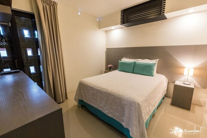 Imagen de la habitación del Hotel Marialicia Suites. Foto 18