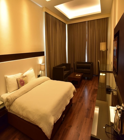 Imagen de la habitación del Hotel Marigold Sarovar Portico Shimla. Foto 8