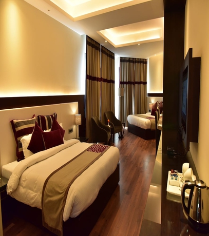Imagen de la habitación del Hotel Marigold Sarovar Portico Shimla. Foto 11