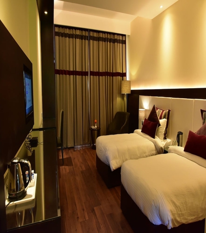 Imagen de la habitación del Hotel Marigold Sarovar Portico Shimla. Foto 12