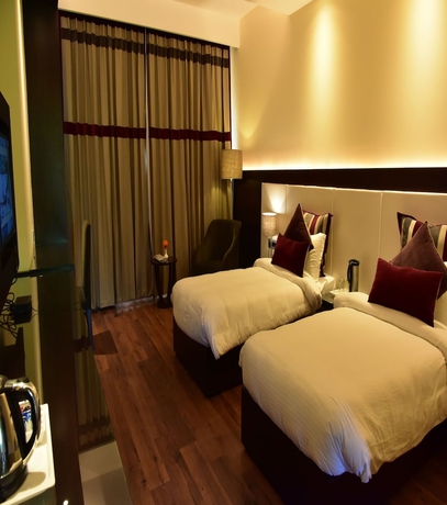 Imagen de la habitación del Hotel Marigold Sarovar Portico Shimla. Foto 13