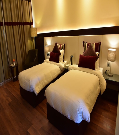 Imagen de la habitación del Hotel Marigold Sarovar Portico Shimla. Foto 14